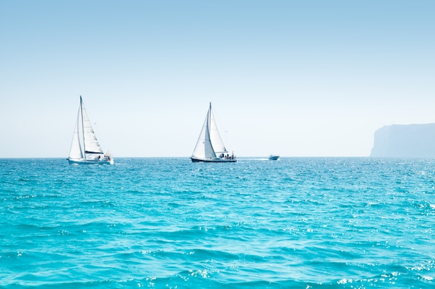 boats sail regatta with sailboats in mediterranean