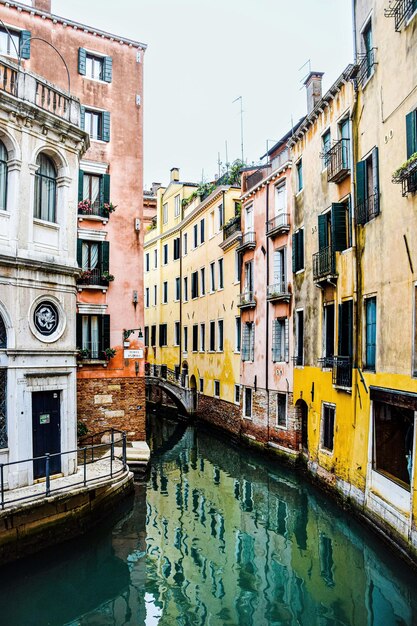 boats sailing in grand canal against sky