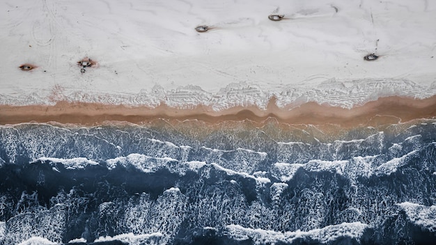 Boats on snowy beach in winter at Baltic Sea