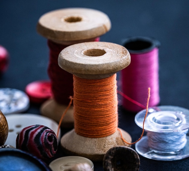 Bobbins of threads near buttons