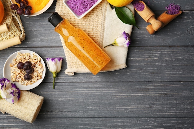 Body care set for peeling on wooden background