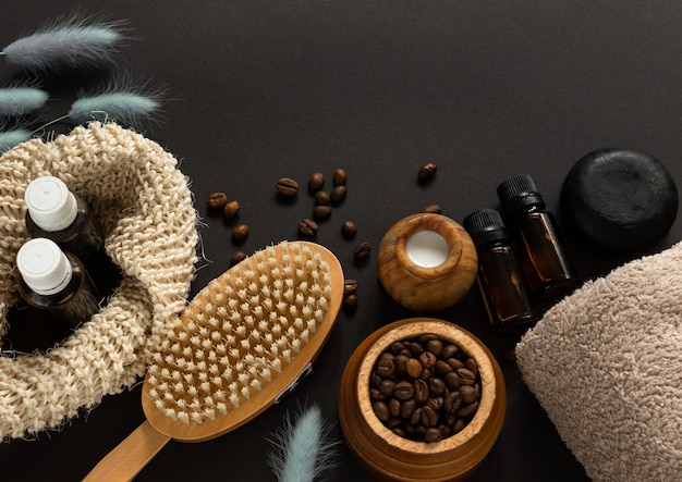 Body massage brush, piece of soap, cream, coffee beans, essential oil