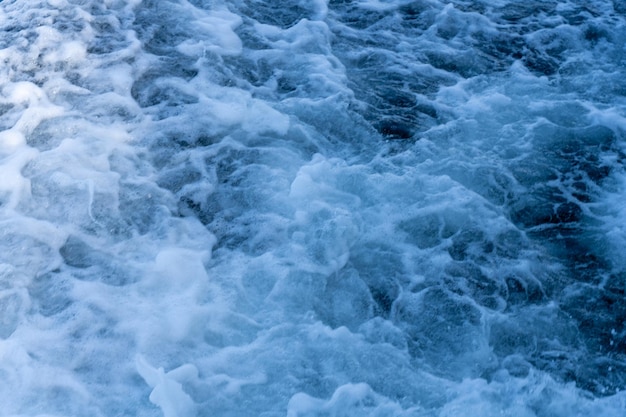 A body of water with a lot of foam and bubbles