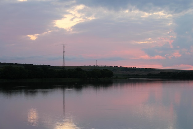 A body of water with a power line in the distance