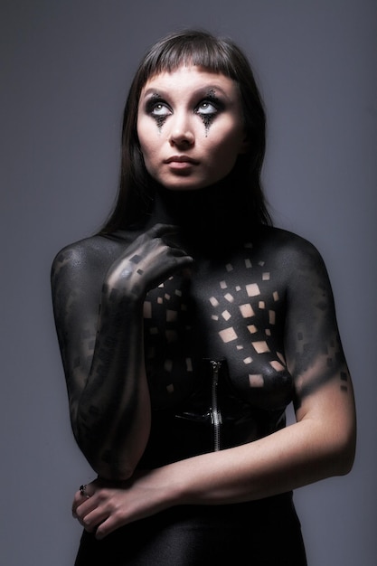 Bodyart paint woman over black background