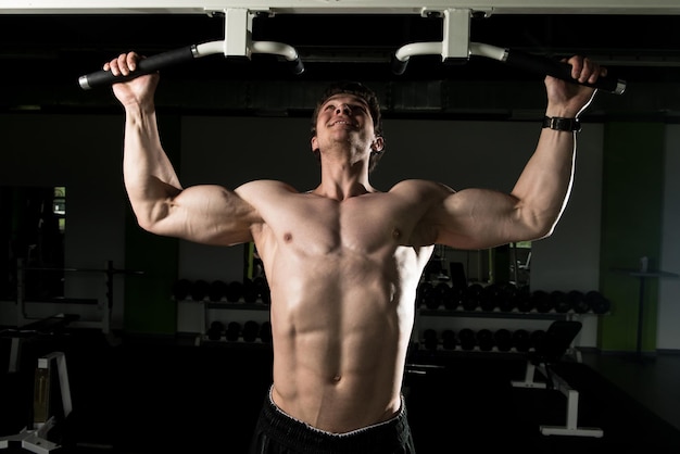 Bodybuilder Doing Pull Ups Best Back Exercises