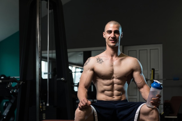 Bodybuilder Drinking Water From Shaker