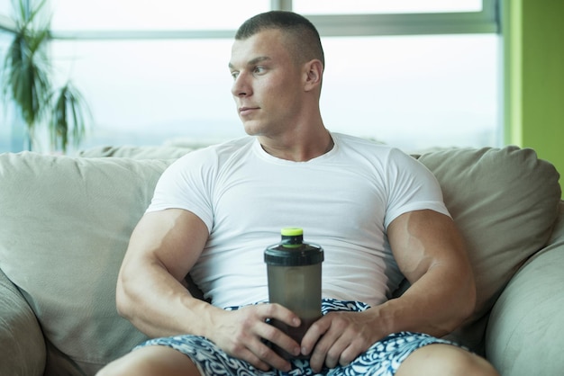 Bodybuilder Drinking Water From Shaker