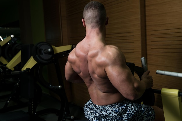 Bodybuilder Exercise Back On Machine