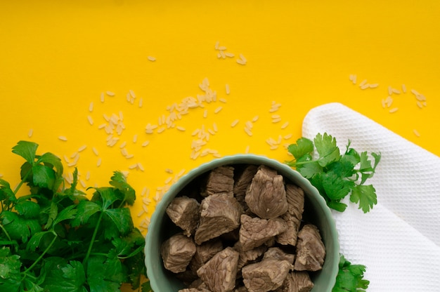 Boiled beef on a yellow. Vertical frame.