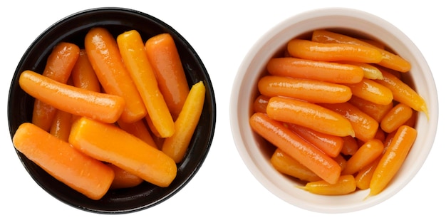 Boiled canned carrots in a bowl isolated on white background