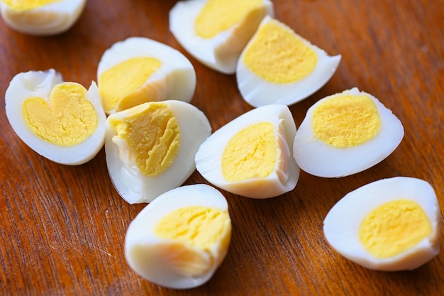 Boiled eggs food quail eggs on wooden breakfast eggs with fresh quail eggs and vegetable lettuce on table background