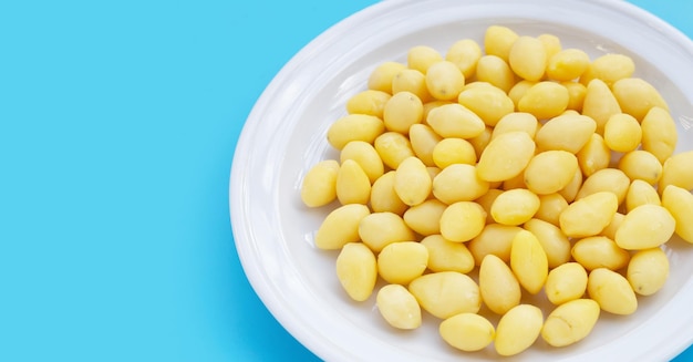 Boiled ginkgo nuts on blue background