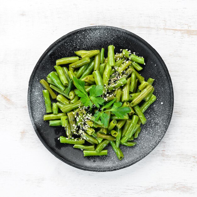 Boiled Green Asparagus Bean In a black plate Top view Free copy space