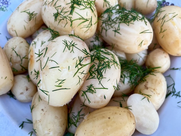 Boiled rustic potatoes on a plate closeup