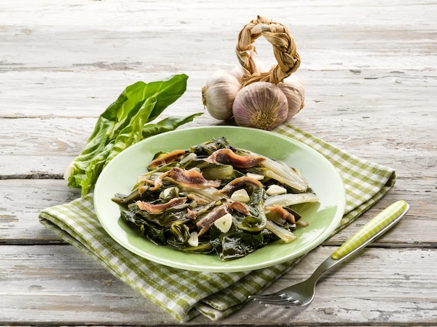 Boiled swiss chard salad with anchovy and garlic