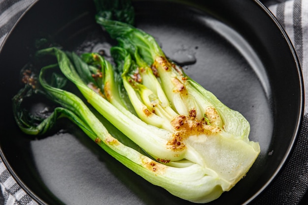 Bok choy or pak choy Chinese stalked cabbage vegetable dish healthy meal food snack on the table