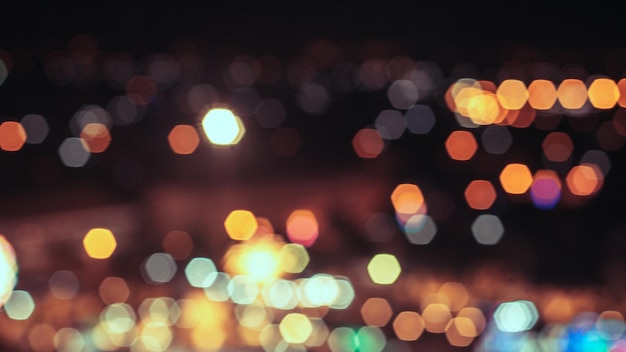 Bokeh city lights background Bokeh of cityscape skyline during evening dark blue sunset dusk twilight