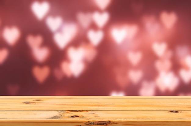 bokeh love hearts red background with wooden table product display