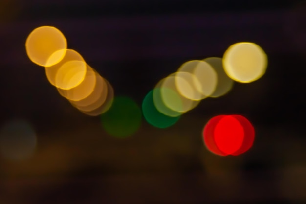 Bokeh of the street at night Blurred light image lights and headlights of cars at night in the city