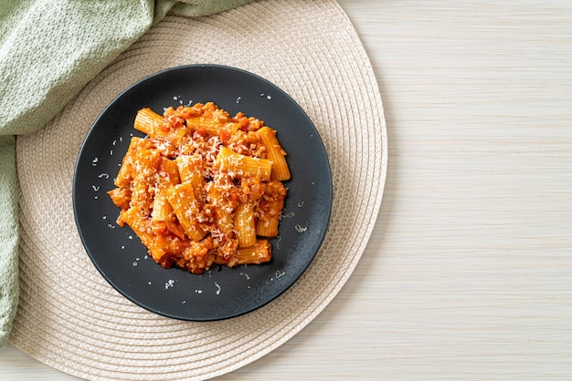 Bolognese rigatoni pasta with cheese traditional Italian pasta