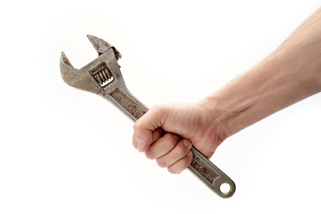 Bolt wrench, adjustable cap wrench in the hand of a worker, builder, isolated on a white background