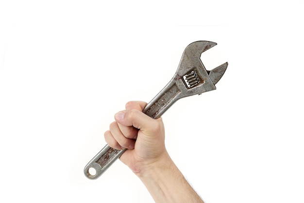 Bolt wrench adjustable cap wrench in the hand of a worker builder isolated on a white background