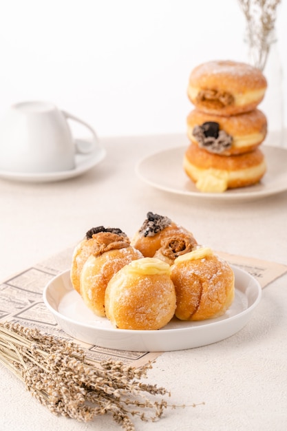 A bombolone or bomboloni is an Italian filled doughnut and is eaten as a snack food and dessert