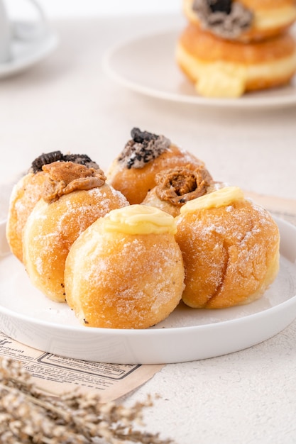 A bombolone or bomboloni is an Italian filled doughnut and is eaten as a snack food and dessert