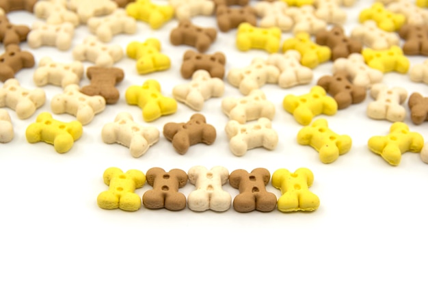 Bone shaped cookies for dogs Multi colored bones of cookies isolated on a white background