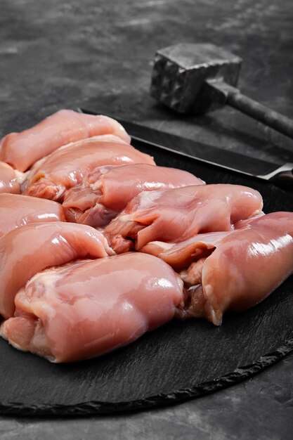 Boneless chicken thigh fillet ready to cook organic products layout for a healthy diet and organic