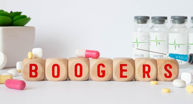 Photo boogers colorful word on the wooden background with stethoscope