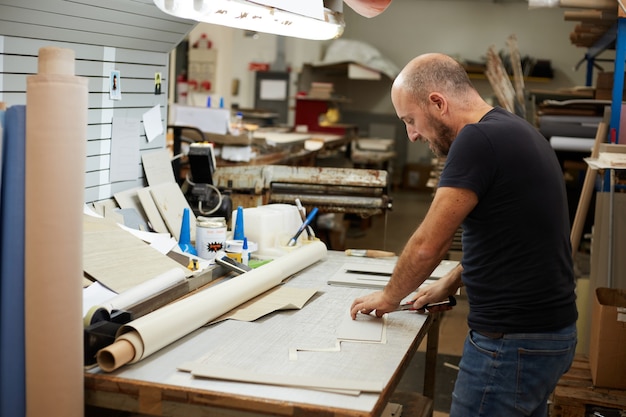 Book binder working in a workshop