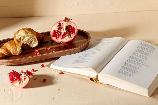 Photo book croissant pomegranate and honey on tray