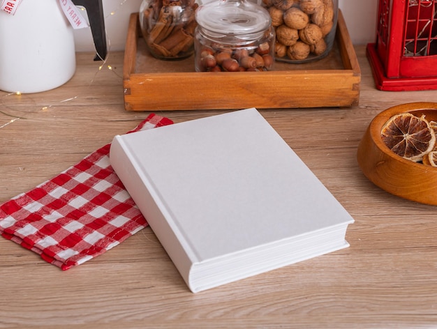 Photo book mockup in kitchen cook table with recipe background top view cookbook food cover empty above