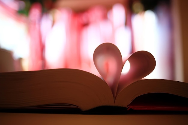 book pages heart background blurred