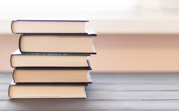 Book stack on wood desk