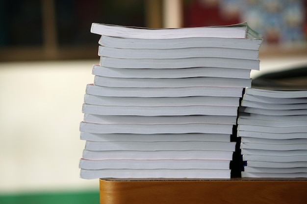 Book stack on wood desk