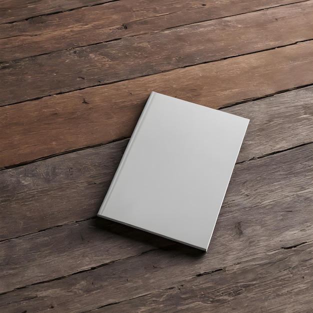 a book on a wooden floor with a white cover