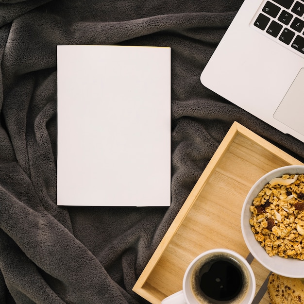 Booklet mockup with breakfast on wooden board