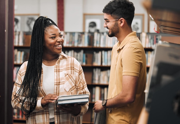 Books library and couple of friends with study communication research and project collaboration for idea goals and learning Nerd diversity students by bookshelf for college university or campus