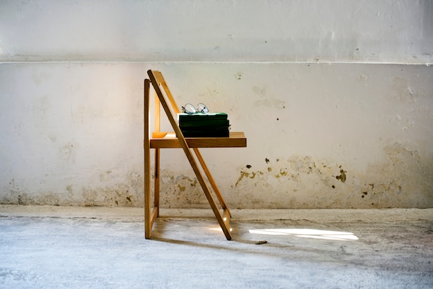 Books stacked on a chair 