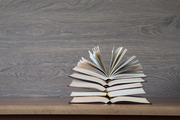 Books on a wooden background