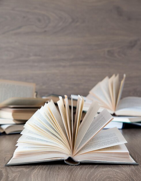 Books on wooden deck tabletop