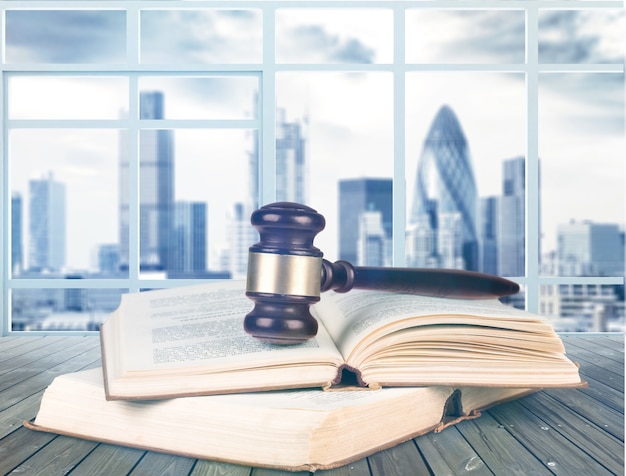 Photo books and wooden gavel on table. justice concept