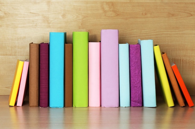 Books on wooden shelf closeup