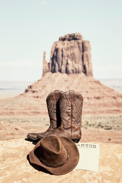 Boots and hat at famous Monument Valley, USA