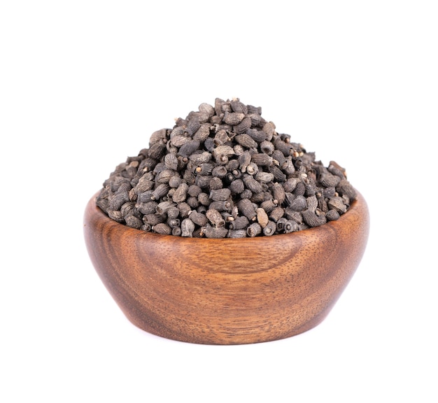 Borage seeds in wooden bowl isolated on a white background Borago officinalis seeds