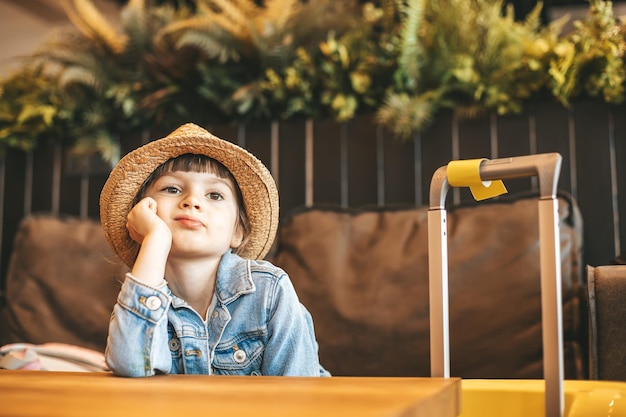 Boring little girl waiting for the flight