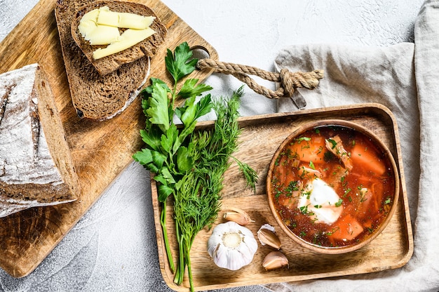 Borsch beetroot soup in a wooden bowl